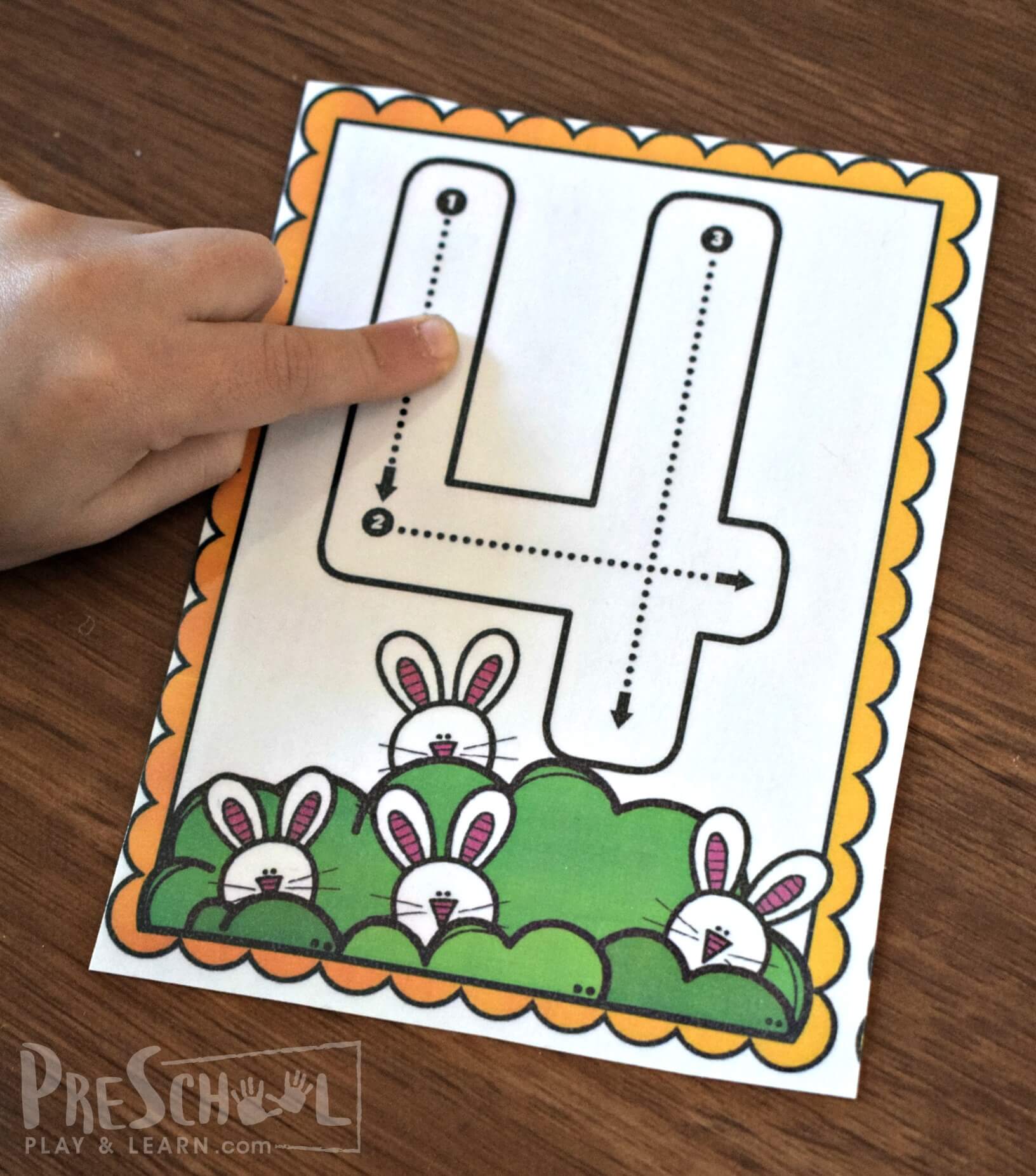 count the spring bunnies at the bottom of the number flashcards and then trace the number