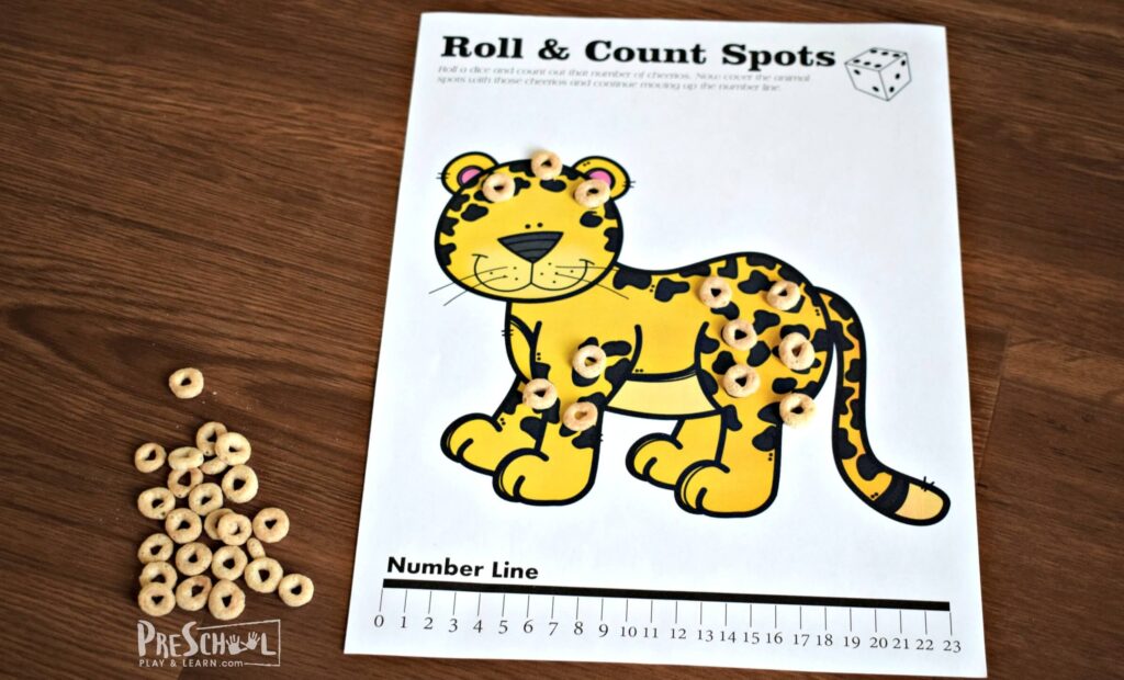 Fun hands on math activity for preschoolers to practice one to one correspondence with Cheerios.