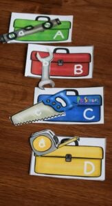 FREE Construction ABC Game is a fun way for kids to practice matching upper and lowercase letters in this tool themed alphabet activity for toddler, preschool, and kindergarten age kids. #preschoolers #alphabet #preschoolthemes