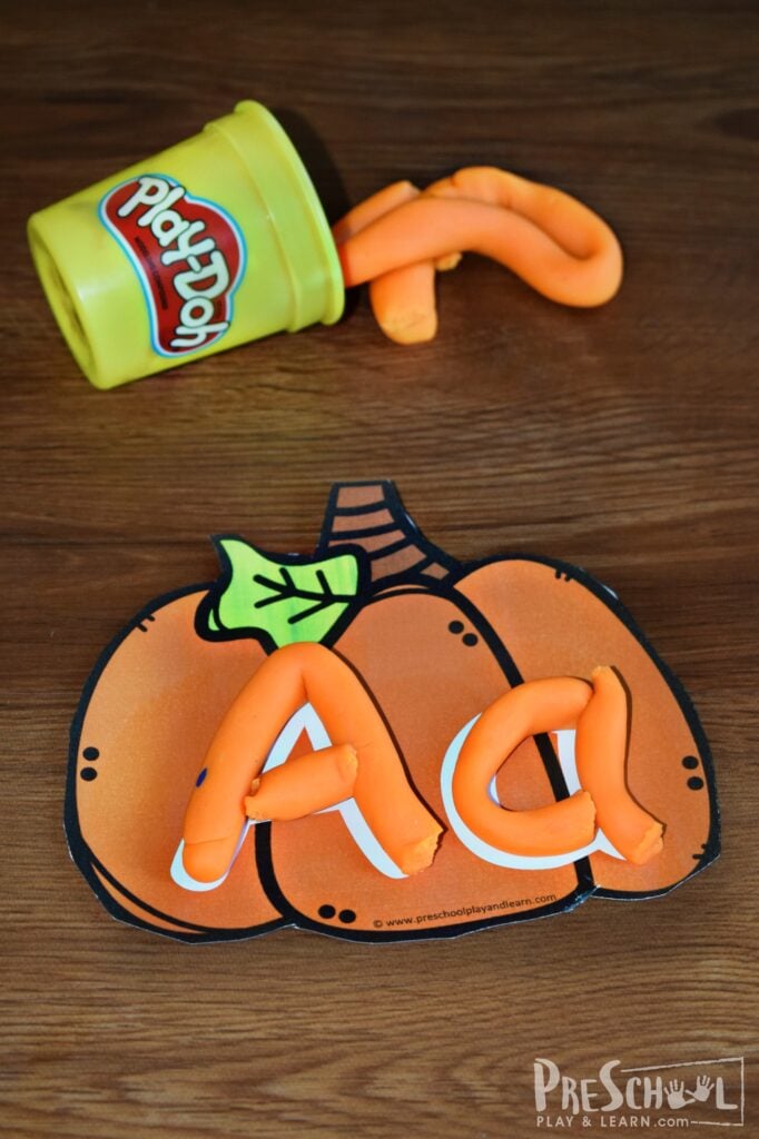 FREE Pumpkin Alphabet Playdough Mats for preschoolers and kindergartners to practice making letters with a fun fall theme