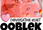 Celebrate Valentines Day in February by whipping up a batch of this realy fun Conversation Heart Ooblek! Making ooblek is quick and easy and loads of fun as this substance is hard in yoru hand and then drizzles out of your hand - WOW! This valentines day activity is perfect for toddler, preschool, pre-k, kindergarten, first grade, and 2nd grade students.  The cute heart candies in the ooblek recipe make this valentines day activities for preschoolers extra fun!