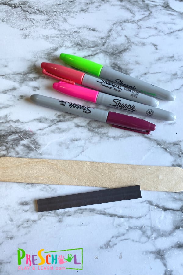 All you need are a few simple materials you may already have on hand: Large Popsicle Stick Sticky Magnetic Strip Markers  magnetic items to move