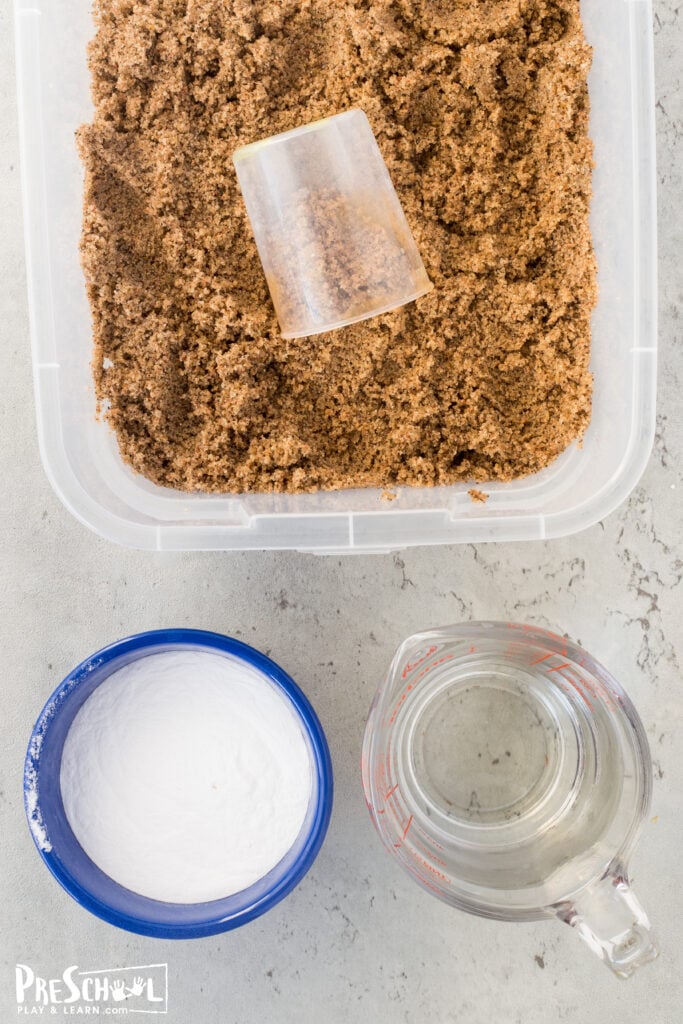 All you need for this super simple summer science activity are a few simple materials: sand bucket or plastic container baking soda vinegar sand seashells (optional)