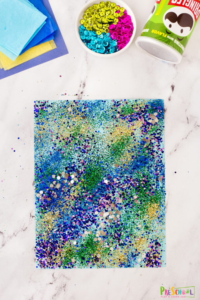 Cover the entire sheet with an even level of glitter. 