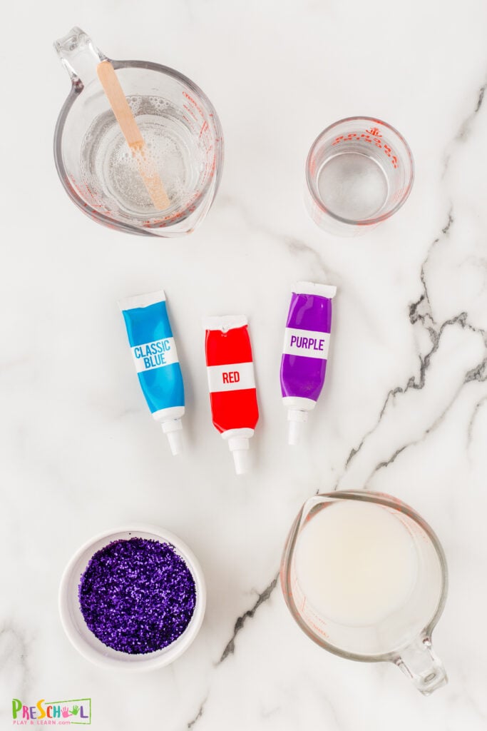 All you need are a few simple materials to whip up a batch of this gorgeous galaxy slime:

clear glue
water
fine purple glitter
food coloring
laundry starch (like Sta Flo)