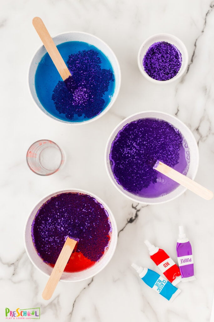 mix colored water and purple glitter