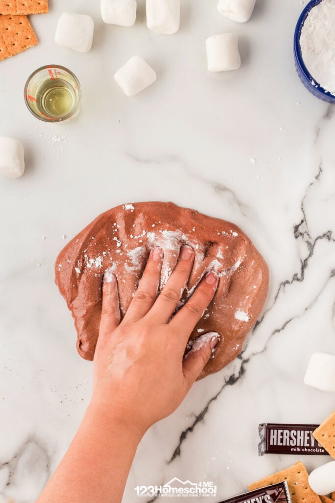 Knead the slime, using powdered sugar on your hands! Add vegetable oil or more powdered sugar to keep the slime from sticking, but the sugar makes it a little more sticky. 